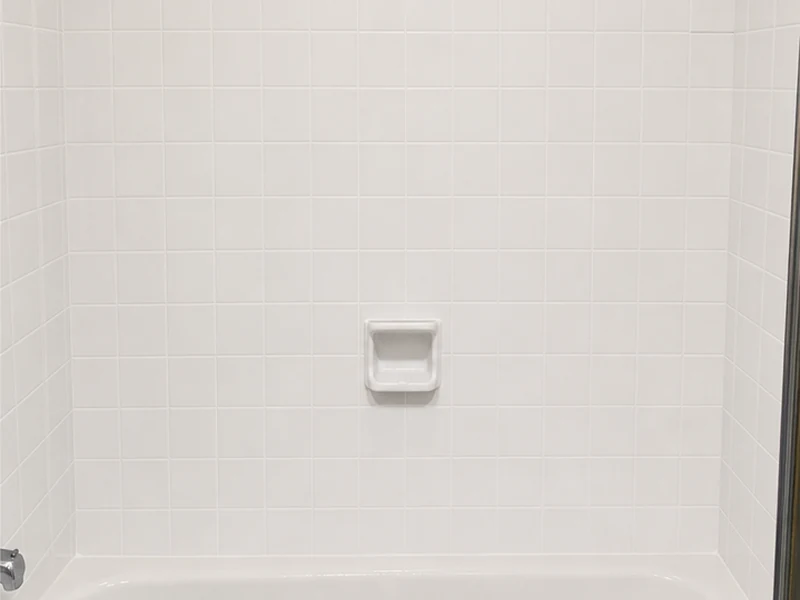 Reglazed bright-white tub-surround tile in a Forest Park Santa Clara bathroom